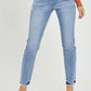 High rise frayed hem skinny jeans by Risen Jeans on model showing trendy and versatile fit