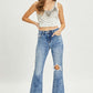 Trendy high-rise distressed flare jeans with vintage-inspired style and edginess from Risen Jeans.