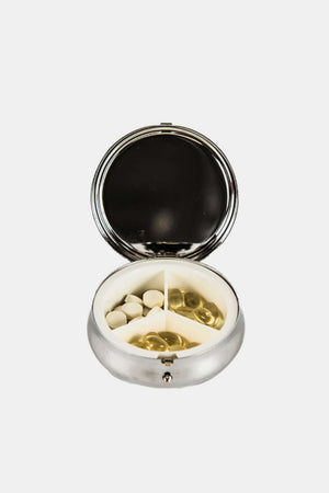 Nicole Lee USA Print Metallic Circular Large Pill Case open with pills inside, silver-tone metal, spacious and elegant design.