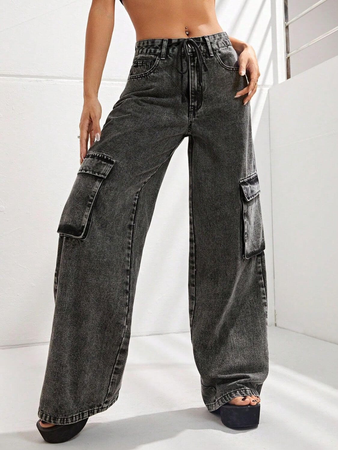 Model wearing Bella Road wide leg jeans with pockets, showcasing the relaxed fit and stylish design, perfect for a casual look.