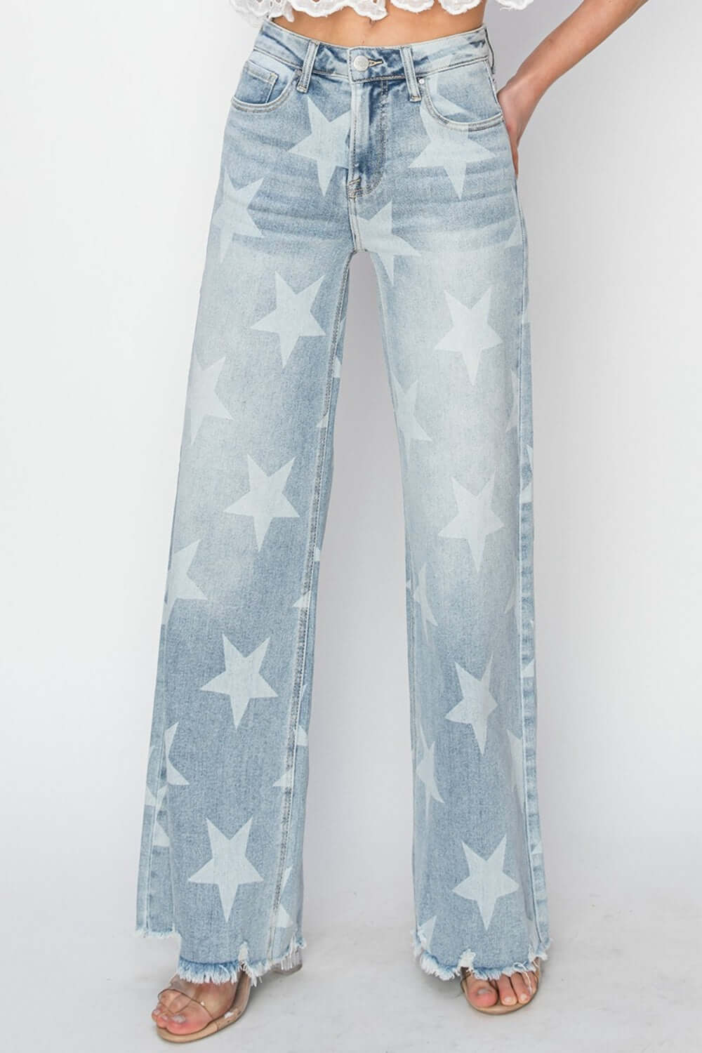 Full Size Raw Hem Star Wide Leg Jeans by Risen Jeans with star embellishments, offering an edgy look and comfortable fit