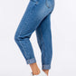 High Waist Pleated Mom Jeans in non-stretch denim with rolled cuffs and white sneakers