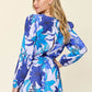 DOUBLE TAKE Full Size Floral Long Sleeve Romper with Pockets at Bella Road