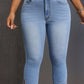 Light blue Bella Road Side Slit Skinny Jeans with pockets, showcasing a stylish slit detail and comfortable fit.