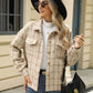 Woman in Bella Road Plaid Collared Neck Long Sleeve Jacket, white top, black hat, sunglasses, jeans, and black handbag.