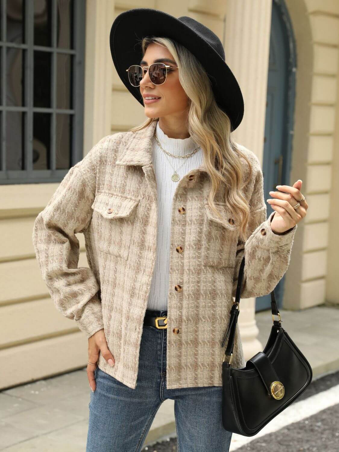 Woman in Bella Road Plaid Collared Neck Long Sleeve Jacket, white top, black hat, sunglasses, jeans, and black handbag.