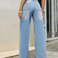 Back view of Bella Road Denim Mid Rise Wide Leg Jeans showcasing a stylish and comfy fit with a playful wide leg design.