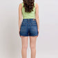 Back view of a model wearing Judy Blue plus size double button waistband denim shorts.