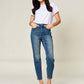 Woman wearing Tummy Control High Waist Slim Judy Blue Jeans in full size, providing a flattering silhouette with midsection support