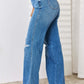 High Waist Distressed Straight-Leg Jeans Full Size by Judy Blue - Side View of Woman in Blue Denim Jeans