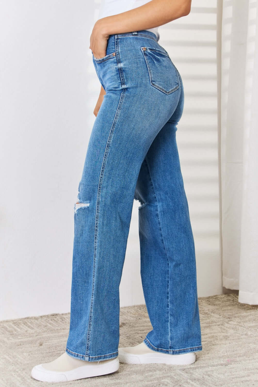 High Waist Distressed Straight-Leg Jeans Full Size by Judy Blue - Side View of Woman in Blue Denim Jeans