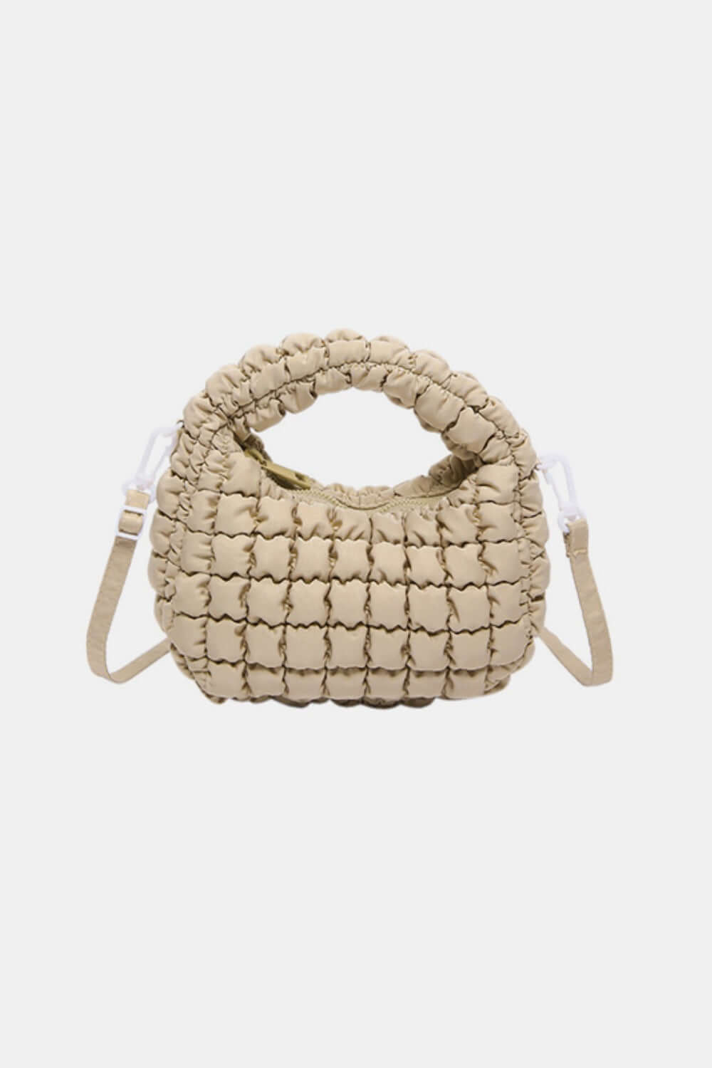 Beige quilted puffy crossbody bag with removable strap and unique design, perfect for elevating fashion style and versatility.