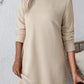 Bella Road textured round neck long sleeve mini dress in beige, showcasing a stylish pattern and comfortable fit.