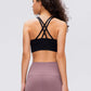 Stylish back view of Millennia Crisscross Scoop Neck Active Tank in black, showcasing its unique crisscross design.