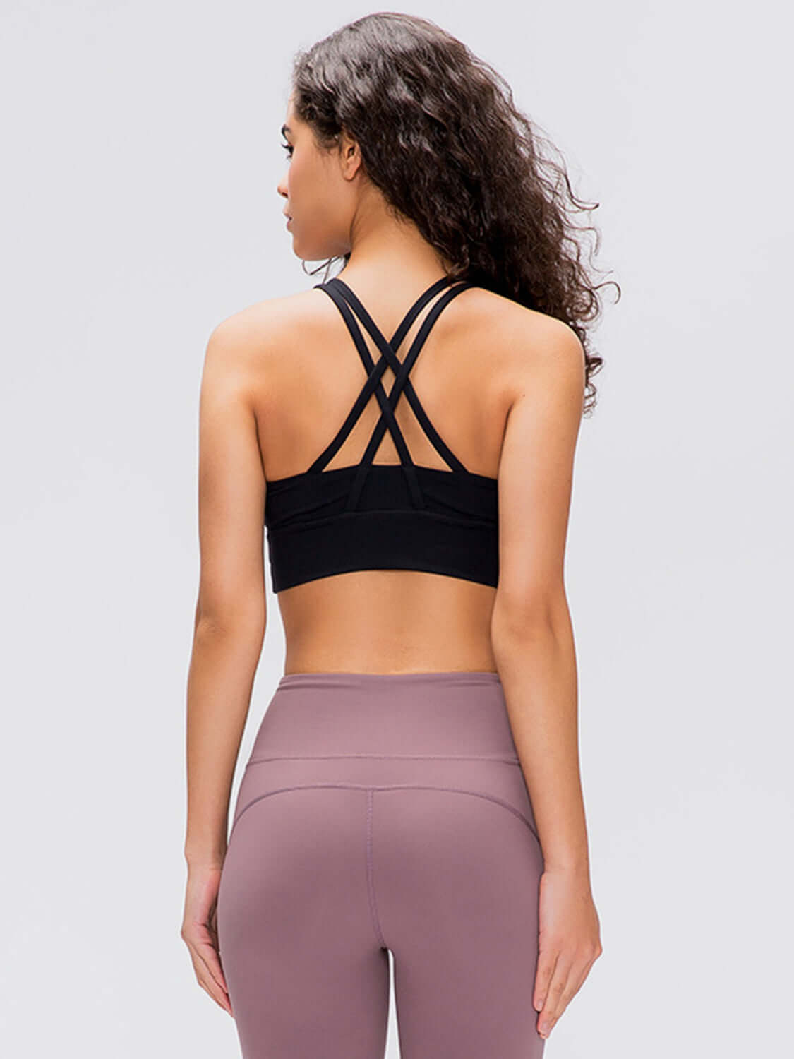 Stylish back view of Millennia Crisscross Scoop Neck Active Tank in black, showcasing its unique crisscross design.