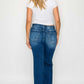 Rear view of a woman wearing bytos High Rise Bootcut Jeans with Pockets, showcasing the flattering fit and style.