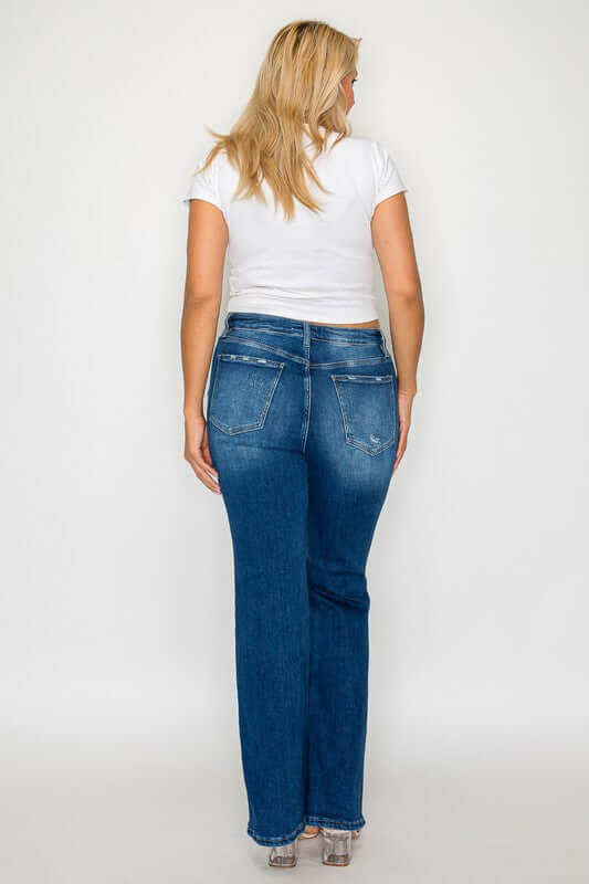 Rear view of a woman wearing bytos High Rise Bootcut Jeans with Pockets, showcasing the flattering fit and style.