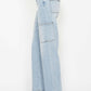 High waist straight cargo jeans with multiple pockets in light blue, Judy Blue Jeans, side profile displaying practical design and versatility