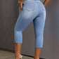 Back view of Bella Road Side Slit Skinny Jeans, showcasing stylish side slits and a comfortable fit with heels.