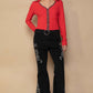 Stylish model wearing POL Raw Hem Embroidered Flare Pants with red top, showcasing bohemian and retro fashion vibes.