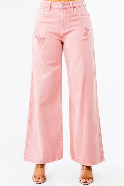 High waist distressed wide leg jeans in pink, offering a trendy and stylish look with relaxed fit.