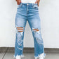 Bella Road distressed raw hem jeans with pockets in light blue, featuring a moderate stretch, perfect for casual wear.