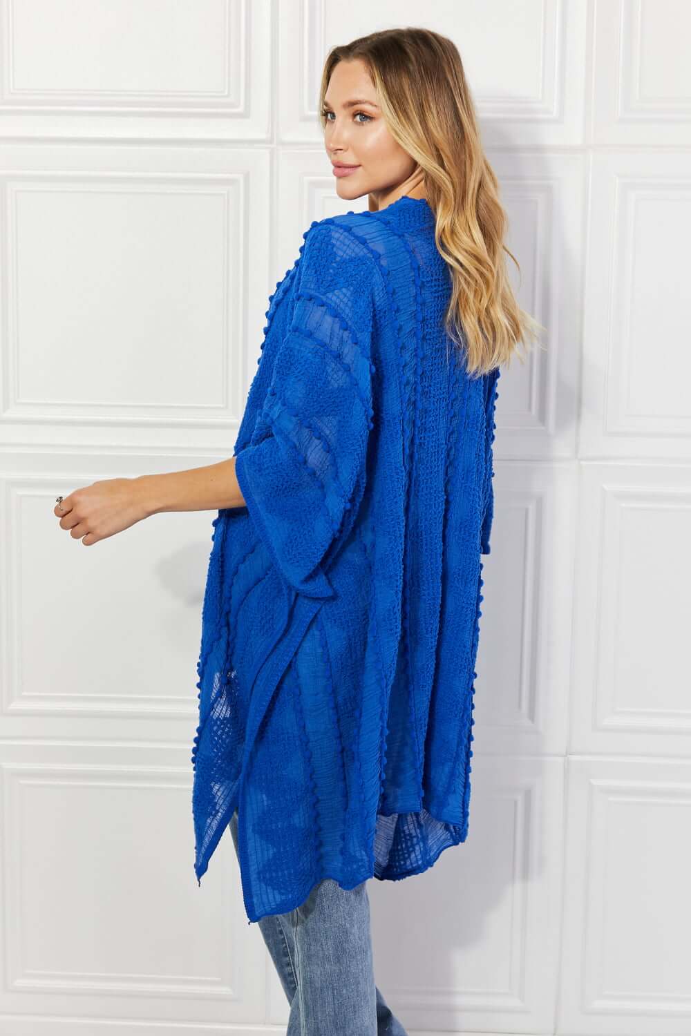 JUSTIN TAYLOR Pom-Pom Asymmetrical Poncho Cardigan in Blue at Bella Road