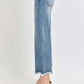 Side view of Risen Jeans High Rise Cropped Flare Jeans showing frayed hem and leopard print heels.