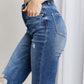 Stylish frayed hem distressed cropped jeans with pockets by Risen Jeans, featuring moderate stretch and raw hems for a casual, chic look.