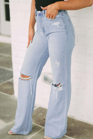 Trendy distressed high waist jeans with slight stretch, perfect for a casual stylish look. Machine washable and imported.