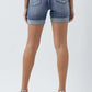 Back view of Distressed Rolled Denim Shorts with Pockets by Risen Jeans, showcasing rolled cuffs and practical pockets.