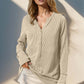 Woman wearing Double Take Full Size Notched Thumbhole Long Sleeve T-Shirt with notched neckline and thumbholes for added comfort and style