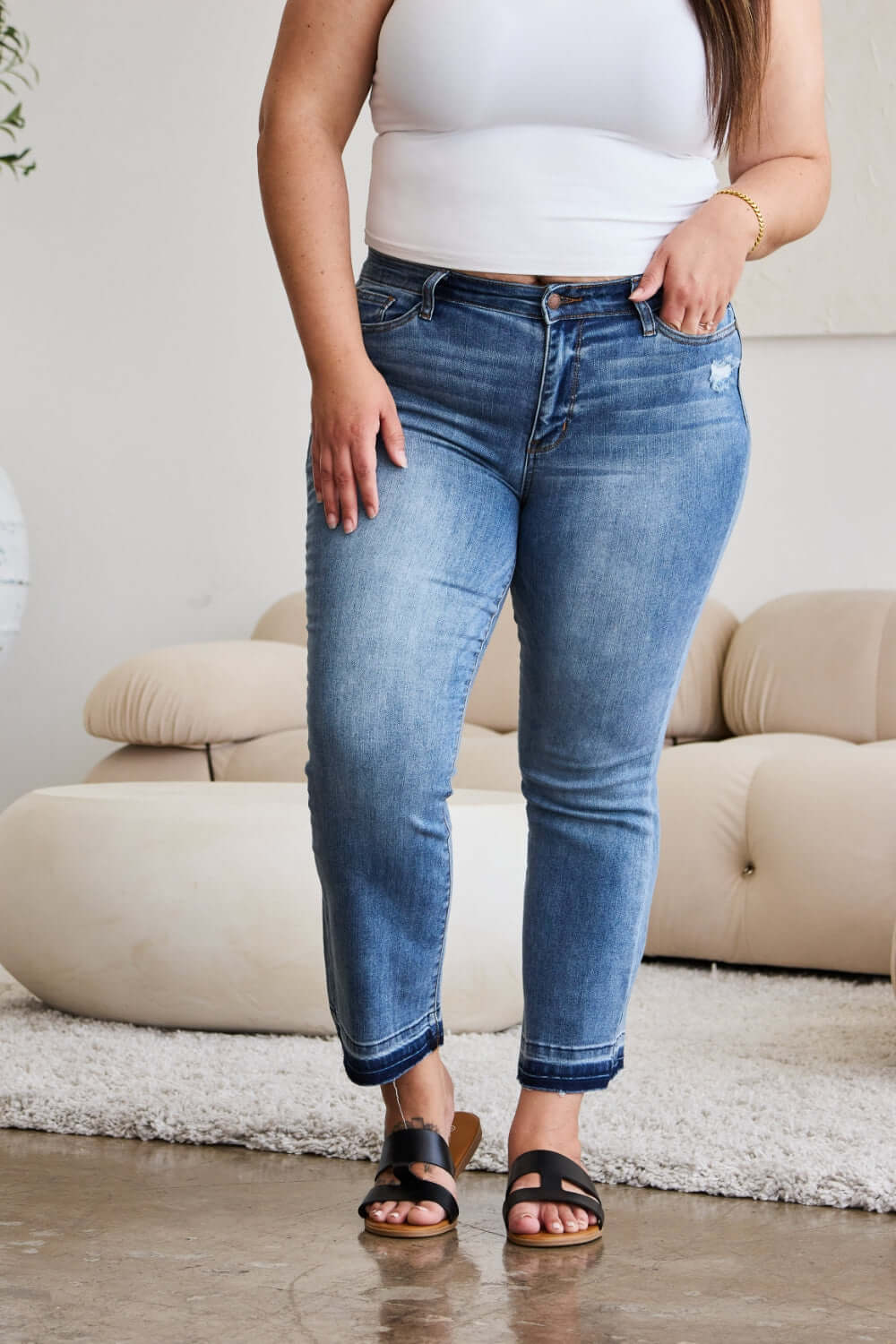 Release Hem Cropped Bootcut Judy Blue Jeans styled with sandals and a white top