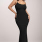 Woman wearing Basic Bae Built-In Shapewear Sleeveless Maxi Dress, showcasing a sleek silhouette and enhancing curves in a stylish black dress