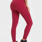 Model showcasing Millennia Highly Stretchy Wide Waistband Yoga Leggings in vibrant burgundy, perfect for yoga and workouts.