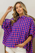 Plaid Button Up Dolman Sleeve Shirt in pink and blue plaid worn by woman