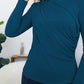 Woman wearing FAM-FAM Ruched Mock Neck Long Sleeve T-Shirt in French Blue, showcasing stylish layering for fall outfits.