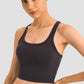 Millennia Racerback Sports Bra in sleek black, perfect for yoga with removable padding and a sporty slim fit.