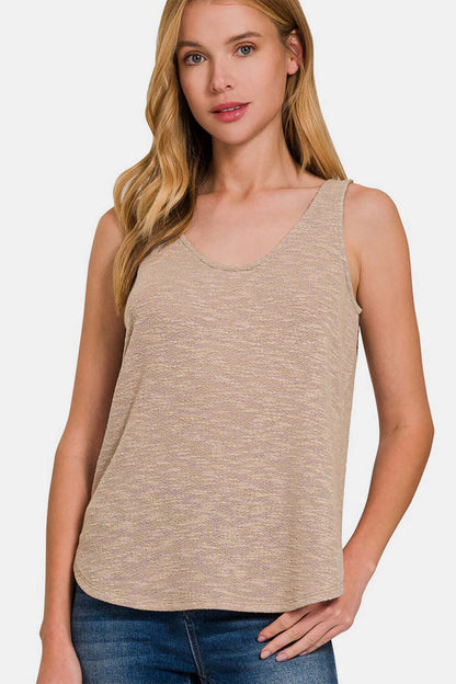 Woman wearing a Curved Hem Round Neck Tank in beige. A stylish sleeveless vest perfect for a casual summer look.