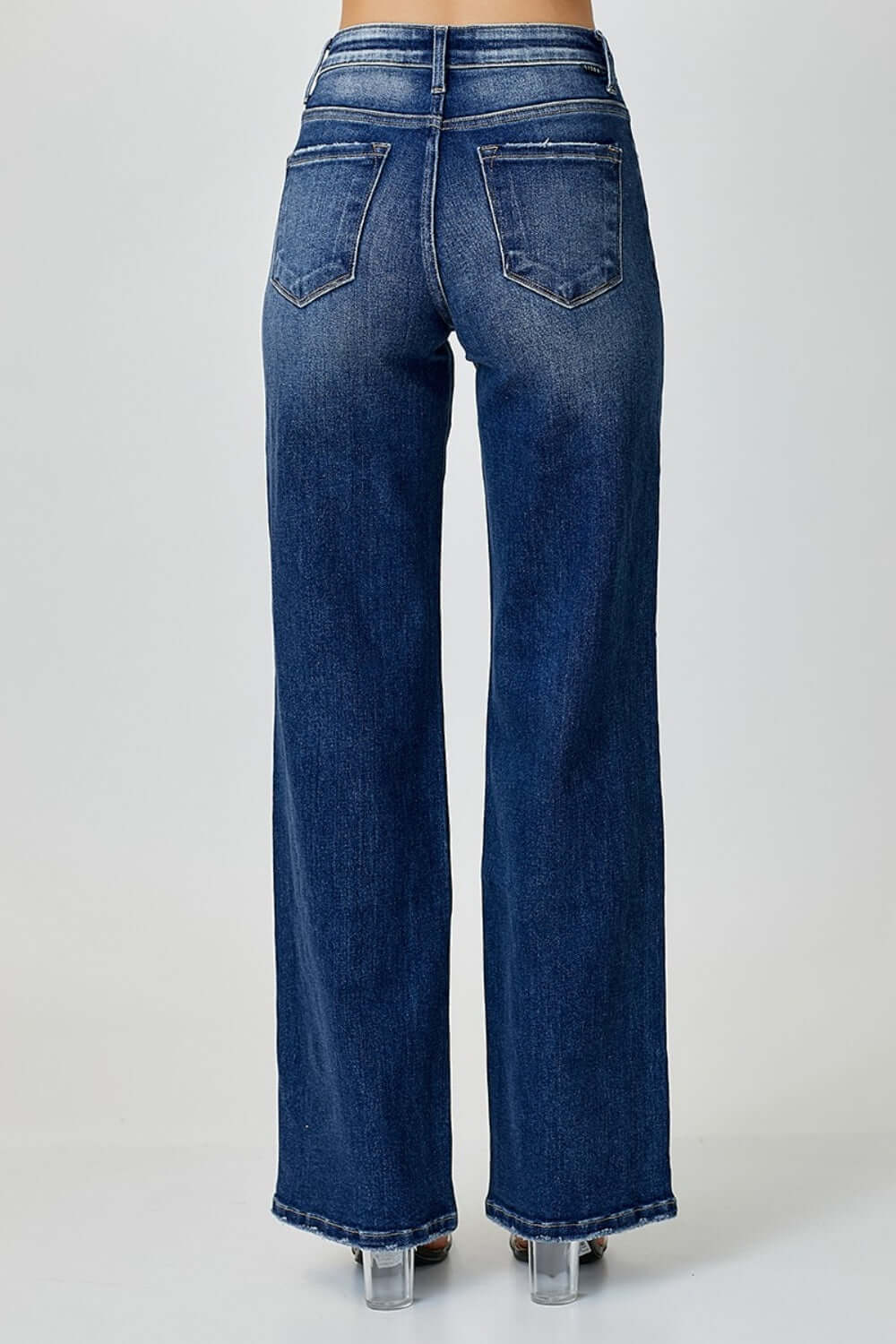 Back view of women's mid-rise straight jeans by Risen Jeans, showcasing classic pockets and durable stretchy denim material.