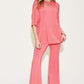 Woman wearing bamboo drop shoulder T-shirt and flare pants set in coral color, basic style, stretchy, two-piece outfit.