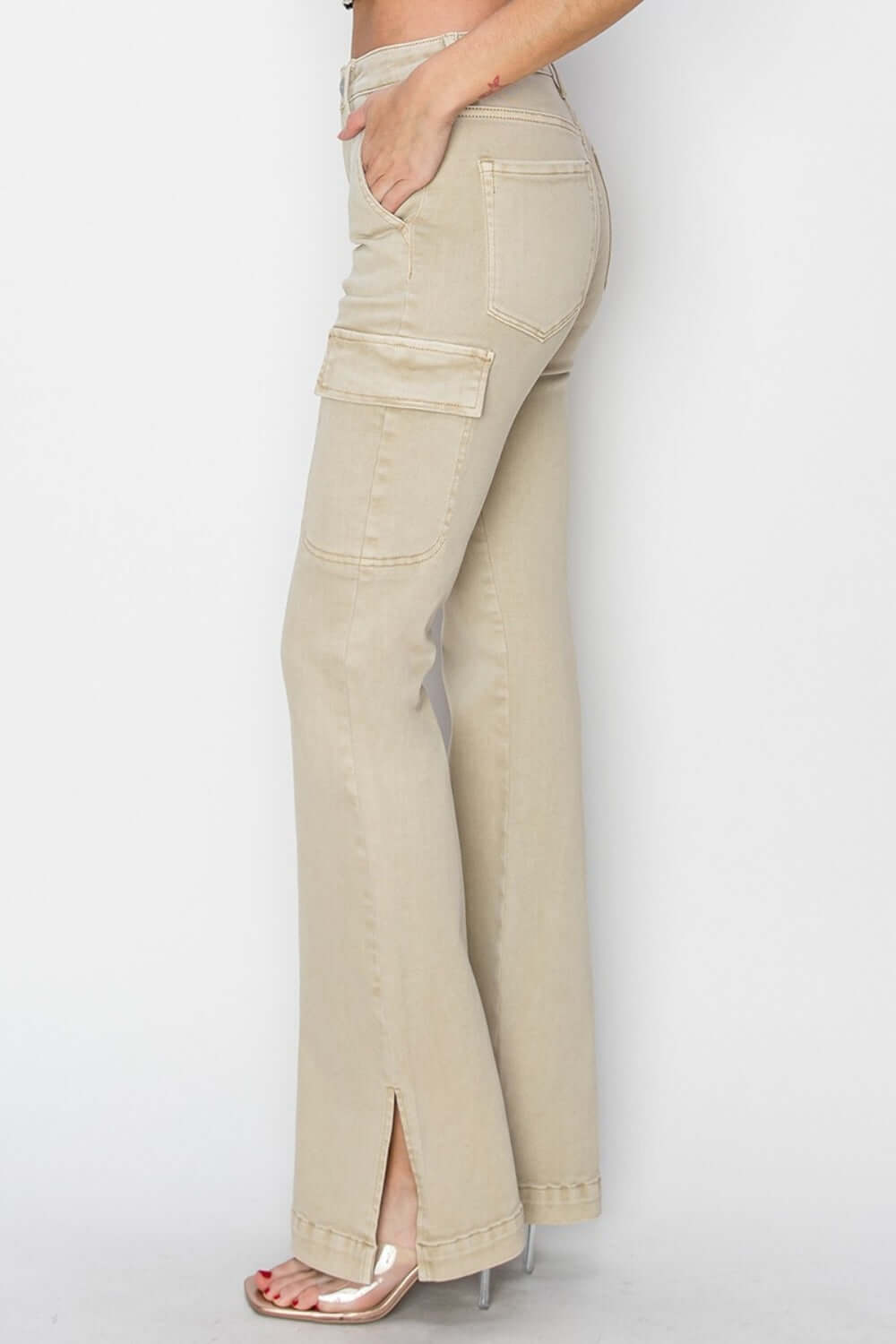 High rise side slit cargo bootcut jeans by Risen Jeans featuring a high waist, bootcut legs, and cargo pockets in beige.