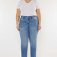 Woman wearing Cat's Whiskers High Waist Jeans with vintage detailing, paired with a white top and black boots.