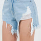 High Waist Fringed Hem Denim Shorts with distressed details in light blue denim, showcasing a bohemian-inspired summer style.