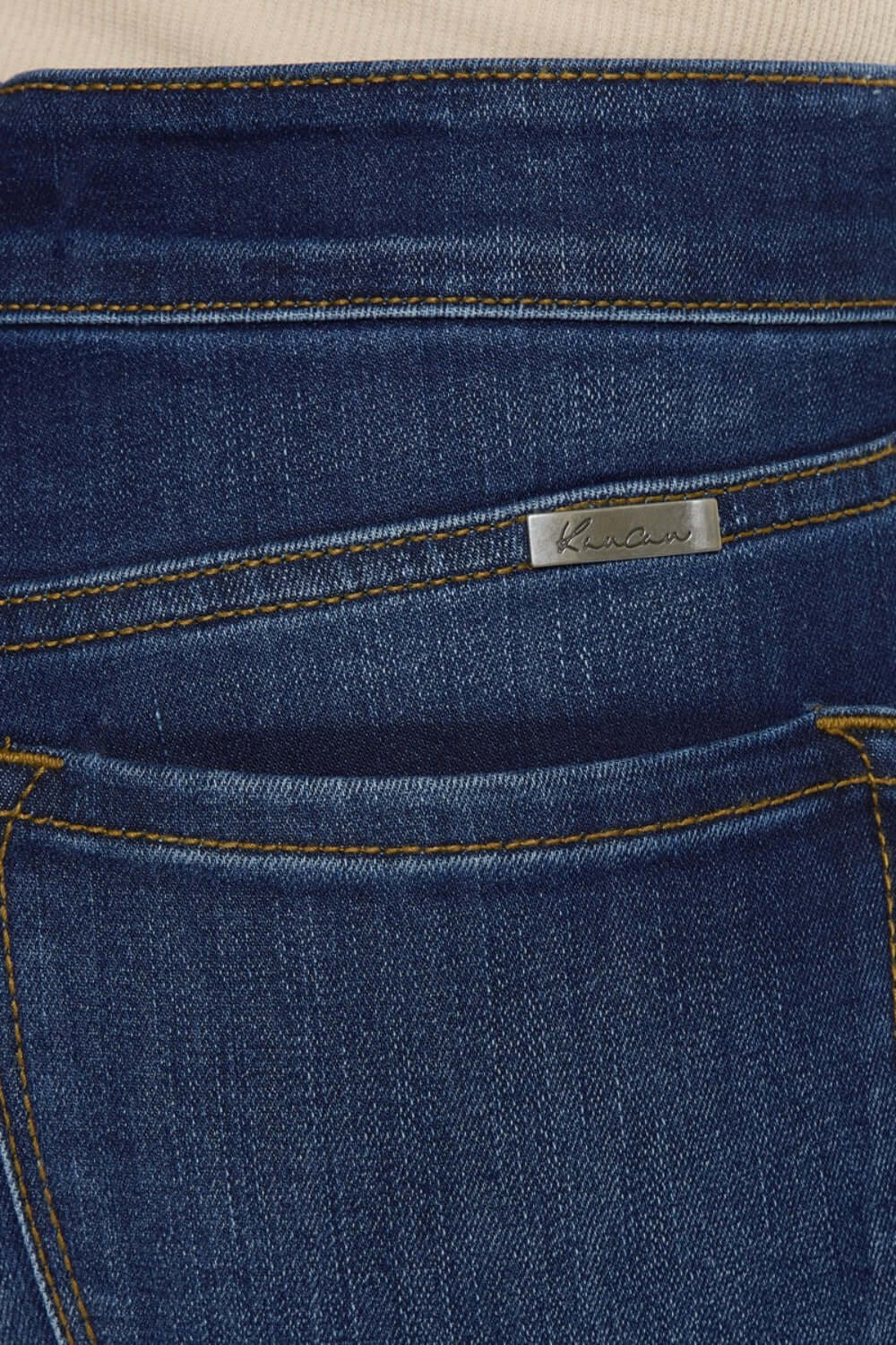 Close-up of the back pocket design on Mid Rise Gradient Skinny Jeans with detailed stitching and fabric texture.