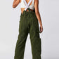 Woman wearing army green Bella Road Pocketed Wide Strap Denim Overalls, featuring wide straps and pockets for a stylish look.