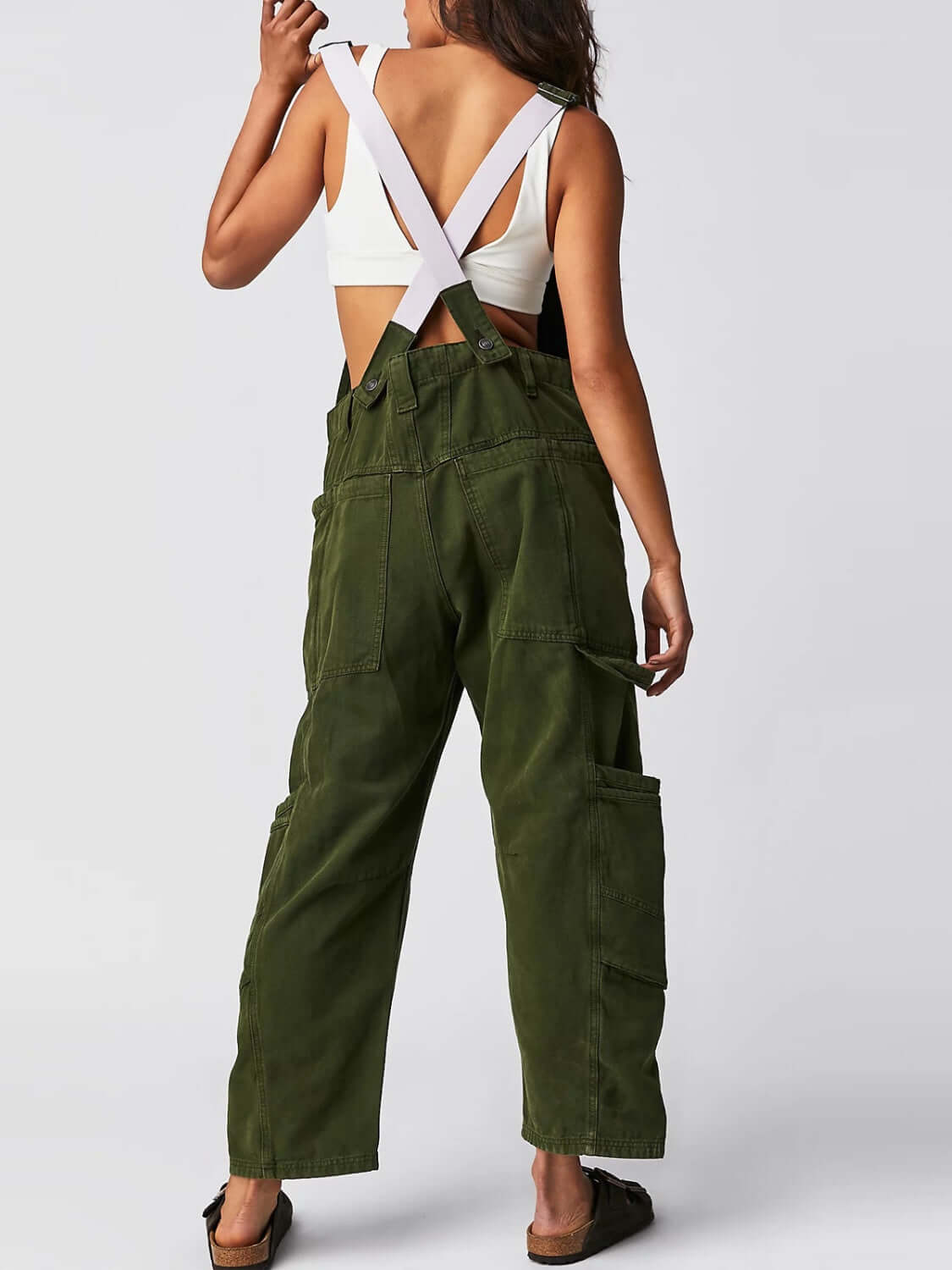 Woman wearing army green Bella Road Pocketed Wide Strap Denim Overalls, featuring wide straps and pockets for a stylish look.