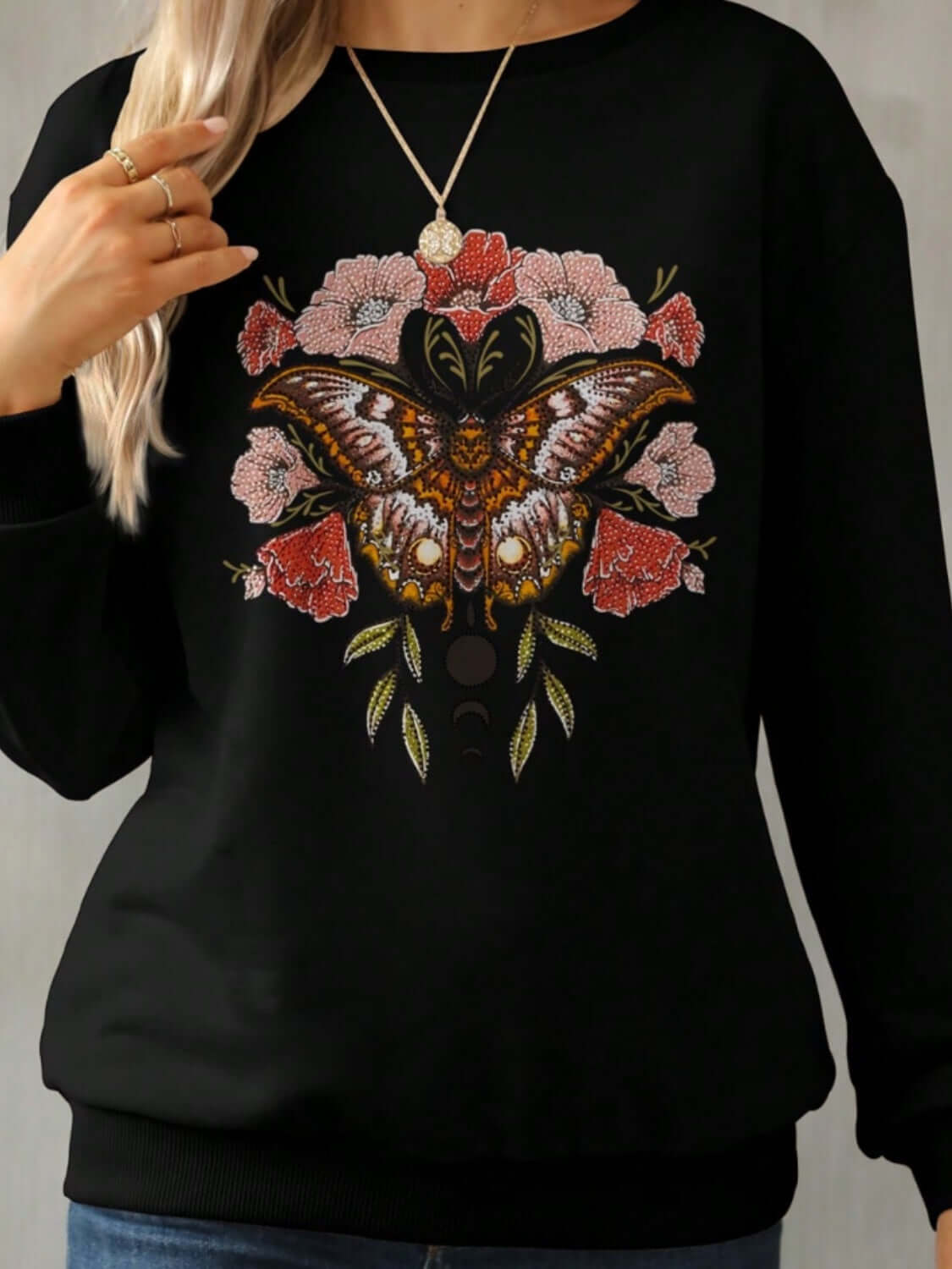 Bella Road Yellowstone Round Neck Long Sleeve Sweatshirt with butterfly and floral design, showcasing cozy style for cool weather.