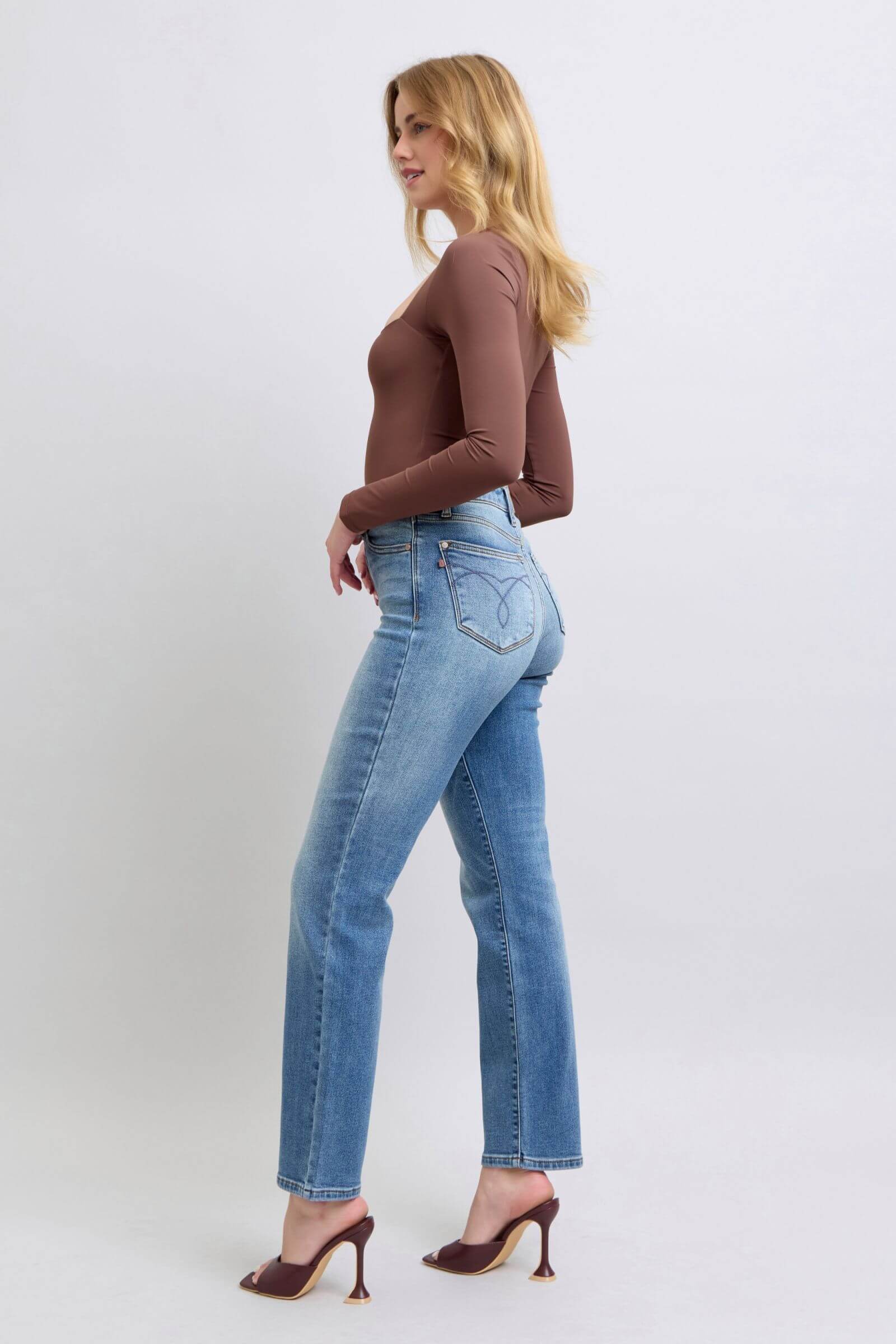 Model wearing Judy Blue vintage wash thermal straight jeans with pockets, styled in a cozy, casual outfit.