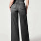 Woman modeling chic wide leg long jeans in solid gray, showcasing back view with moderate stretch fit and basic style.